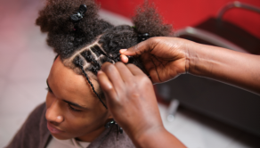 person braiding hair