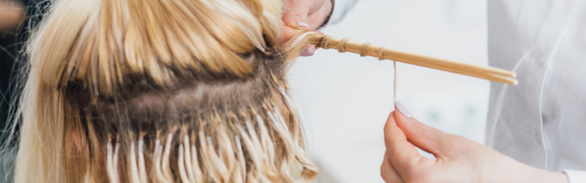 someone adding hair extension